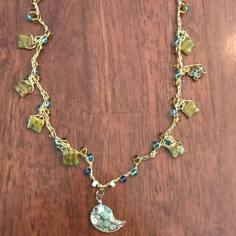 Gold metallic braided thread and beads crescent pendant